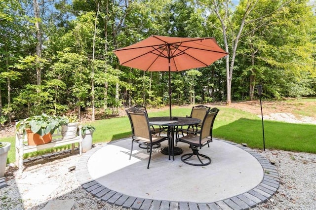 1127 Oak Hollow Ct, Hampton, GA 30228 - view of patio with outdoor dining space and view of scattered trees