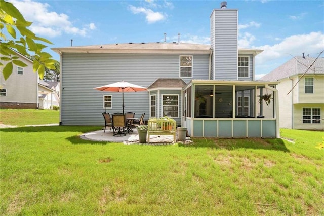 1127 Oak Hollow Ct, Hampton, GA 30228 - back of house with a sunroom, a chimney, a patio area, and a yard