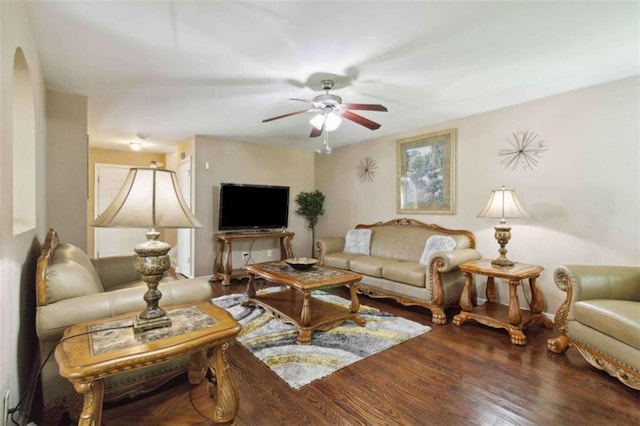 1127 Oak Hollow Ct, Hampton, GA 30228 - living area featuring a ceiling fan, arched walkways, and wood finished floors