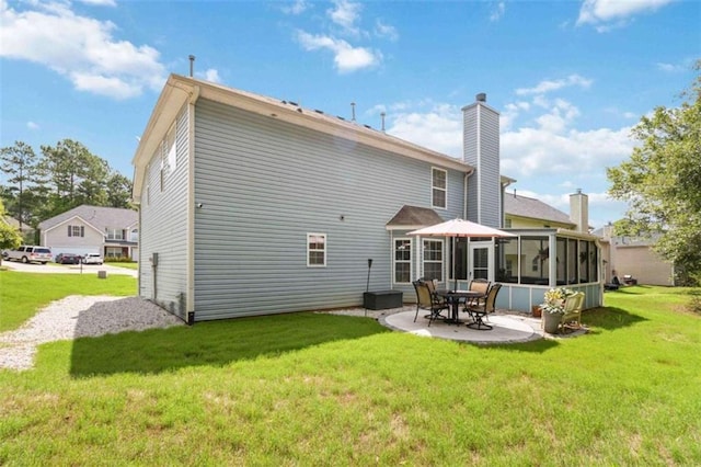 1127 Oak Hollow Ct, Hampton, GA 30228 - back of property with a patio, a yard, and a sunroom