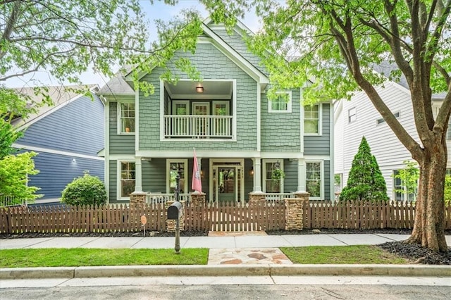 1622 Gates Pl NW, Atlanta, GA 30318 - craftsman-style house with covered porch, a balcony, and a fenced front yard