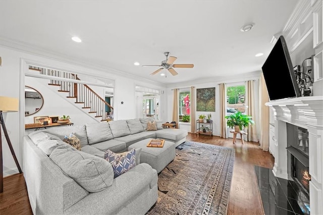 1622 Gates Pl NW, Atlanta, GA 30318 - living room featuring a high end fireplace, ceiling fan, healthy amount of natural light, stairway, and ornamental molding