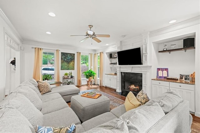 1622 Gates Pl NW, Atlanta, GA 30318 - living area featuring ceiling fan, a fireplace with flush hearth, wood finished floors, crown molding, and recessed lighting