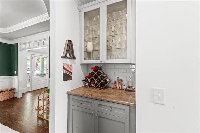 1622 Gates Pl NW, Atlanta, GA 30318 - indoor dry bar with ornamental molding, decorative backsplash, dark wood-style flooring, and a wainscoted wall