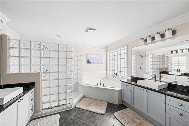 1622 Gates Pl NW, Atlanta, GA 30318 - bathroom with tiled shower, two vanities, a garden tub, crown molding, and healthy amount of natural light