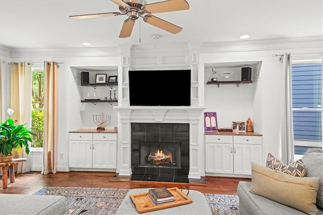 1622 Gates Pl NW, Atlanta, GA 30318 - living area with dark wood-style floors, ceiling fan, a fireplace, ornamental molding, and recessed lighting