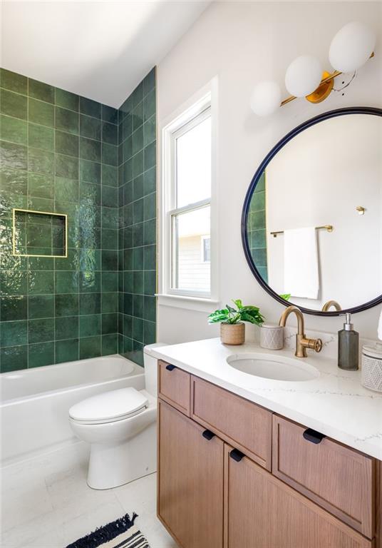 full bathroom with toilet, shower / bathtub combination, tile patterned floors, and vanity