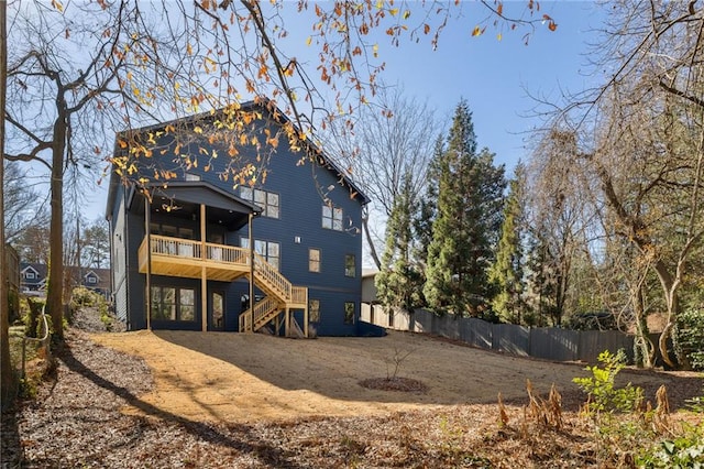 rear view of property featuring a balcony