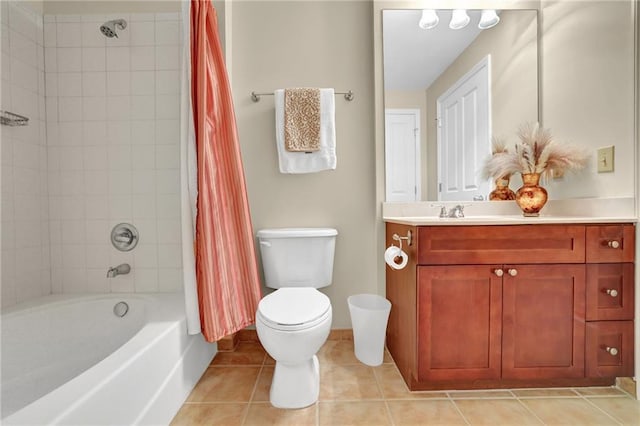 full bathroom with tile patterned floors, vanity, shower / tub combo with curtain, and toilet