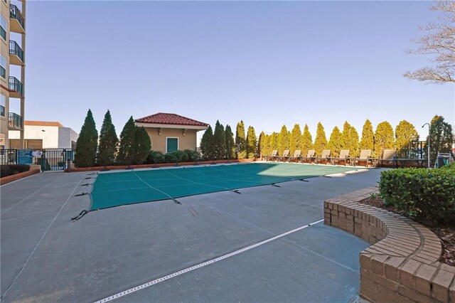 view of swimming pool featuring a patio