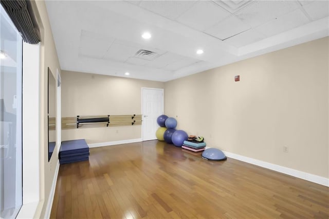 exercise room featuring hardwood / wood-style floors