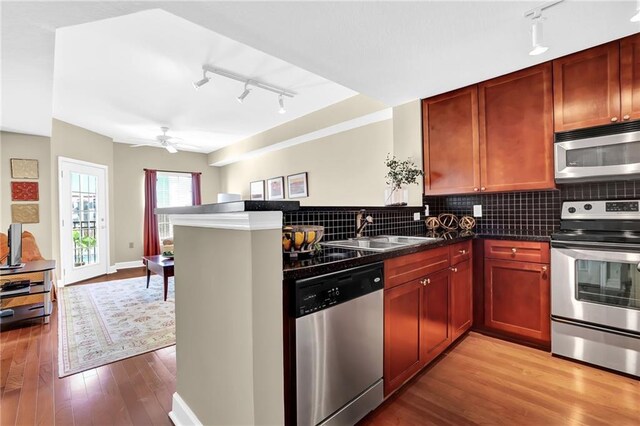 living room with hardwood / wood-style floors and ceiling fan