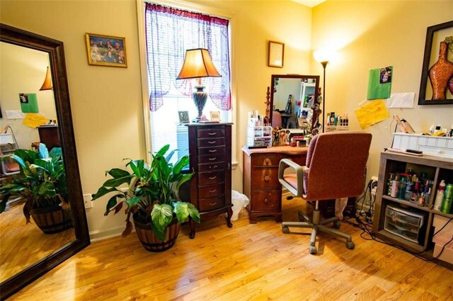 home office with wood finished floors