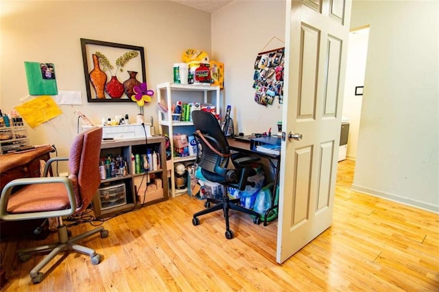 office area featuring wood finished floors and baseboards