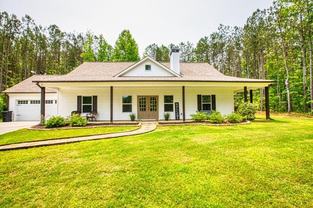 594 Maner Rd, Rockmart, GA 30153 - farmhouse-style home with an attached garage, a front lawn, a chimney, concrete driveway, and covered porch