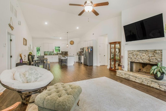 594 Maner Rd, Rockmart, GA 30153 - living room with ceiling fan, high vaulted ceiling, dark wood-style flooring, a fireplace, and recessed lighting
