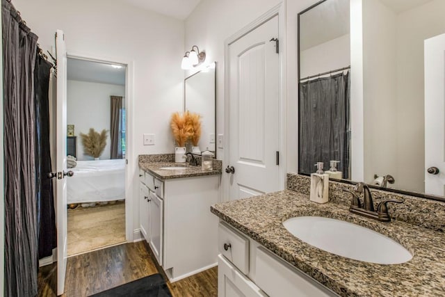 594 Maner Rd, Rockmart, GA 30153 - full bathroom with wood finished floors, vanity, and ensuite bathroom
