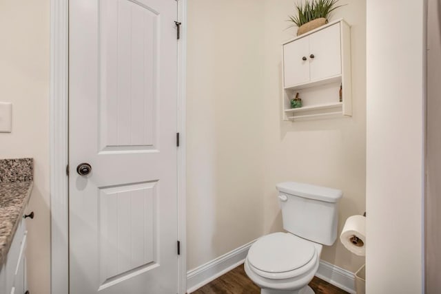 594 Maner Rd, Rockmart, GA 30153 - bathroom featuring vanity, toilet, baseboards, and wood finished floors