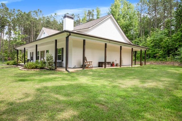 594 Maner Rd, Rockmart, GA 30153 - view of side of home with a yard, a chimney, and a shingled roof