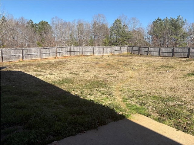 view of yard with a fenced backyard