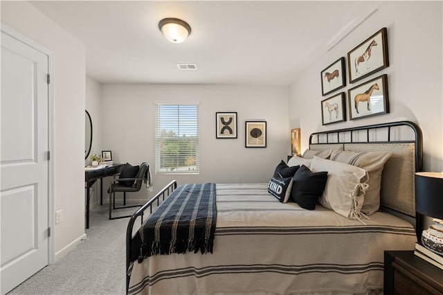 bedroom with carpet, visible vents, and baseboards