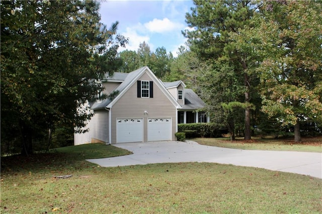 view of home's exterior with a yard and a garage