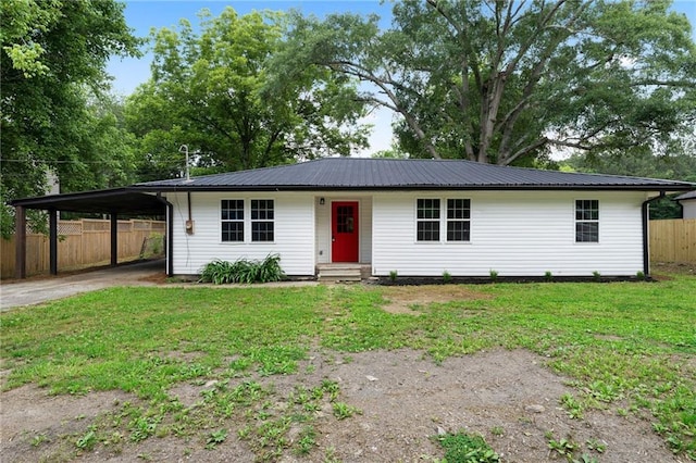 44 Crayton St, Rockmart, GA 30153 - single story home with driveway, a carport, metal roof, and entry steps