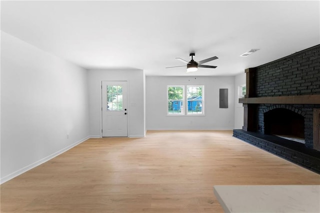 44 Crayton St, Rockmart, GA 30153 - unfurnished living room with light wood finished floors, a ceiling fan, baseboards, and a fireplace