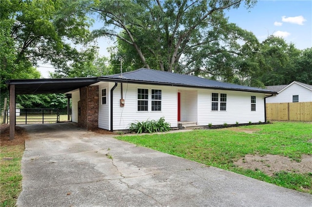44 Crayton St, Rockmart, GA 30153 - ranch-style house with driveway, an attached carport, and metal roof