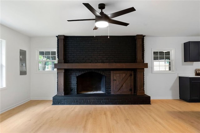 44 Crayton St, Rockmart, GA 30153 - unfurnished living room featuring light wood-type flooring, electric panel, a ceiling fan, and baseboards
