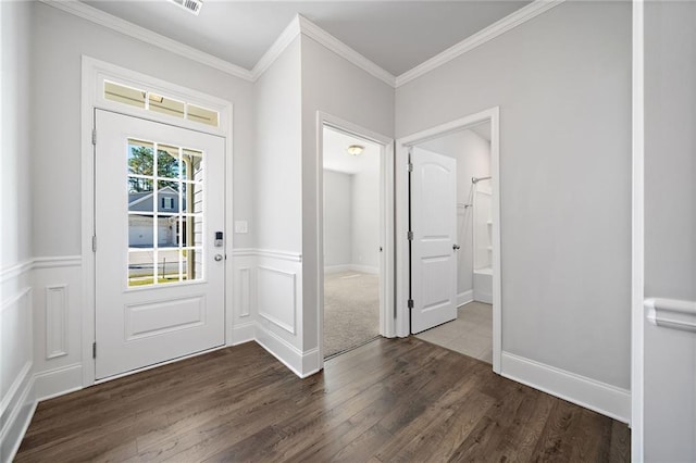 doorway to outside featuring dark hardwood / wood-style floors and ornamental molding