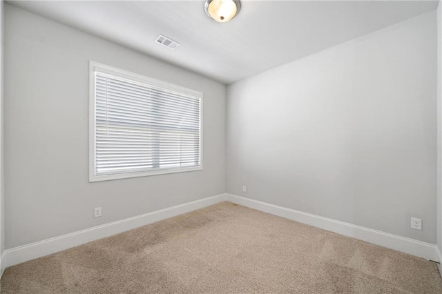 unfurnished room featuring carpet floors