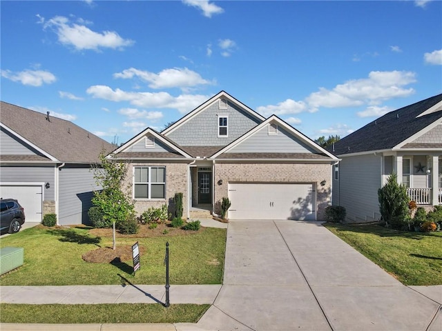 view of front of property featuring a front yard and a garage