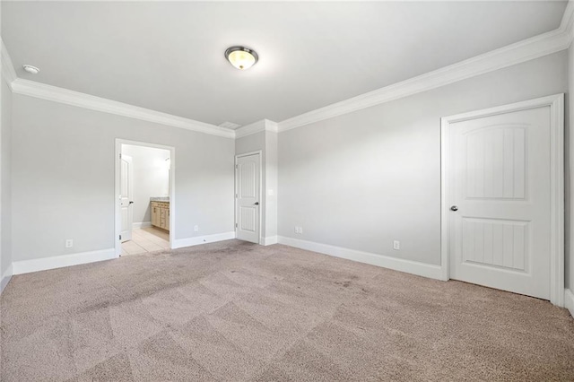 spare room with light carpet and ornamental molding