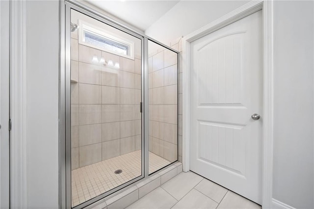 bathroom with tile patterned floors and an enclosed shower