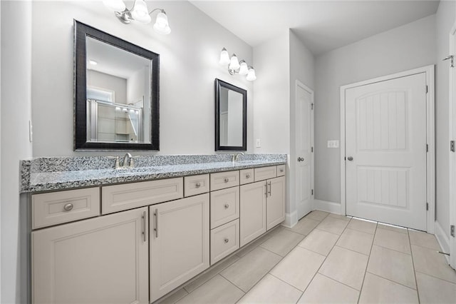 bathroom with vanity, tile patterned floors, and walk in shower