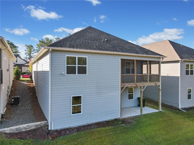 back of house with a yard and a patio area