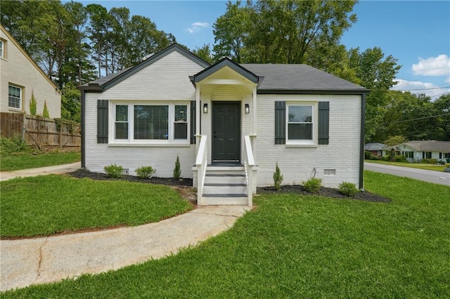 bungalow with a front lawn