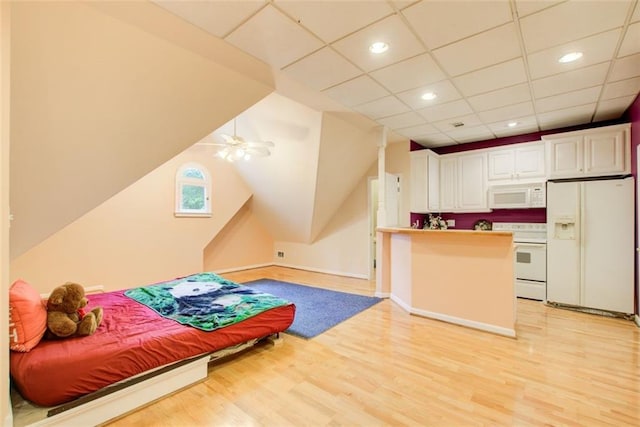 bedroom featuring baseboards, recessed lighting, white refrigerator with ice dispenser, and light wood-style floors