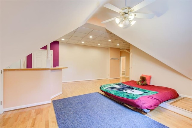 bedroom featuring recessed lighting, baseboards, wood finished floors, and ceiling fan