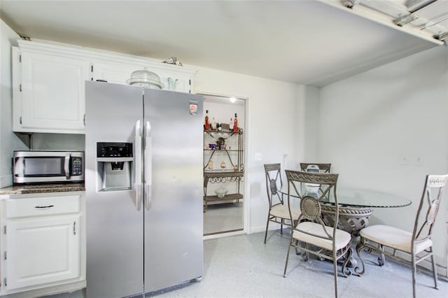 kitchen featuring appliances with stainless steel finishes and white cabinets