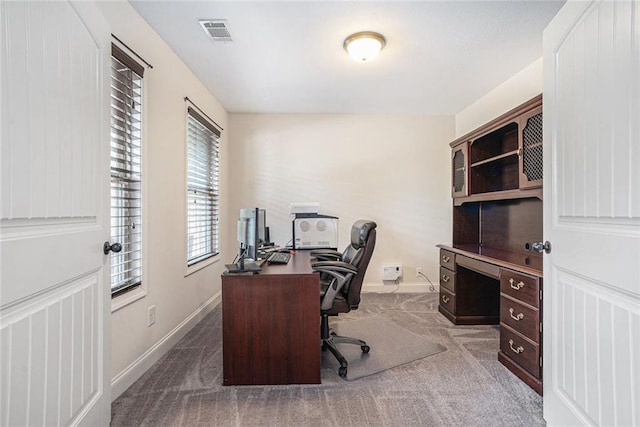 office area featuring dark colored carpet