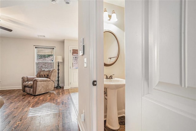 bathroom with sink, wood-type flooring, and ceiling fan