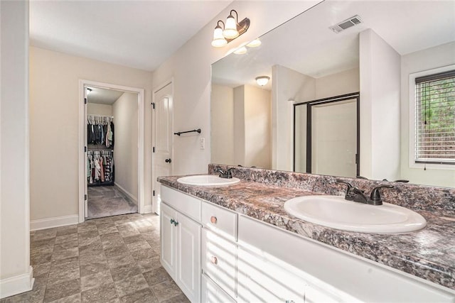 bathroom with vanity and an enclosed shower