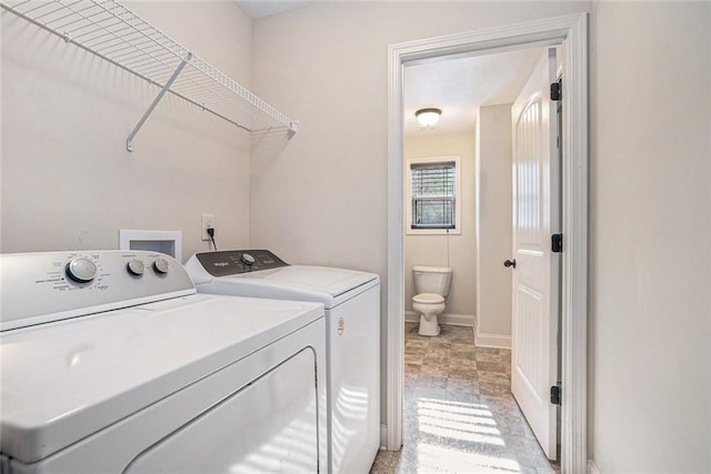 clothes washing area featuring washing machine and clothes dryer