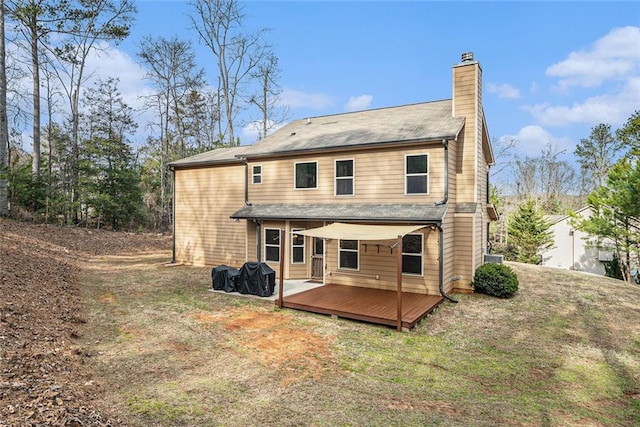 rear view of property with a deck