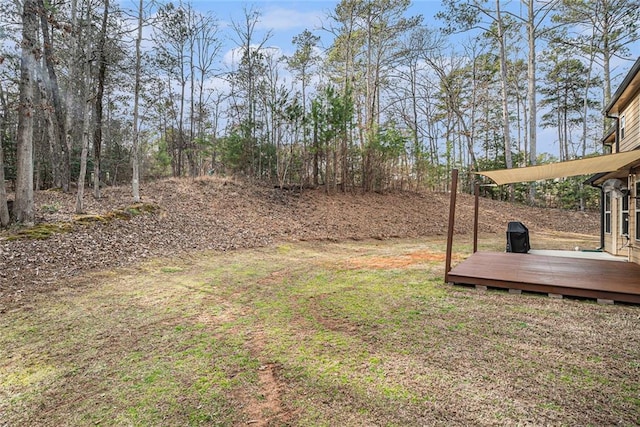 view of yard with a wooden deck