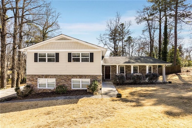 tri-level home with stone siding