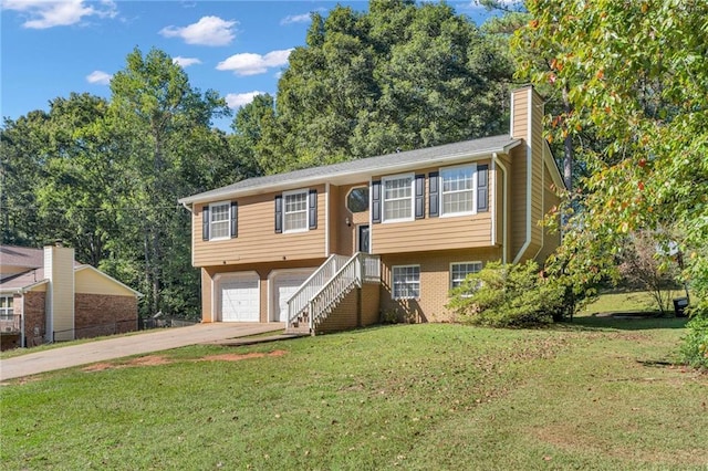 bi-level home featuring a front lawn and a garage