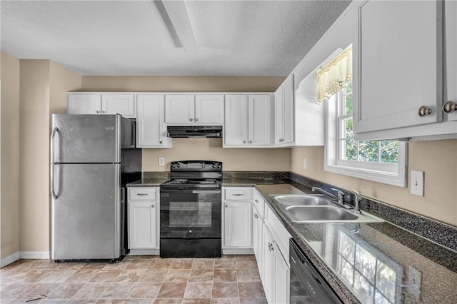 kitchen featuring a textured ceiling, stainless steel appliances, sink, and white cabinetry